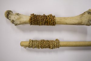 Bone and stick with wrapped cording