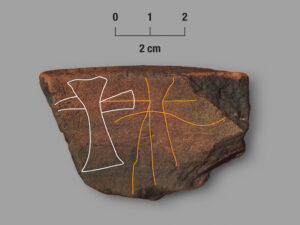 Potsherd with incised cross on gray background, highlighted in white and orange lines